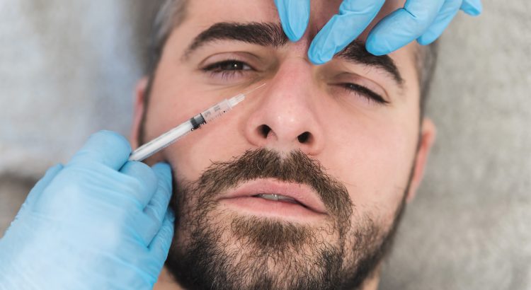Man rceiving botox to the forehead at botox clinic