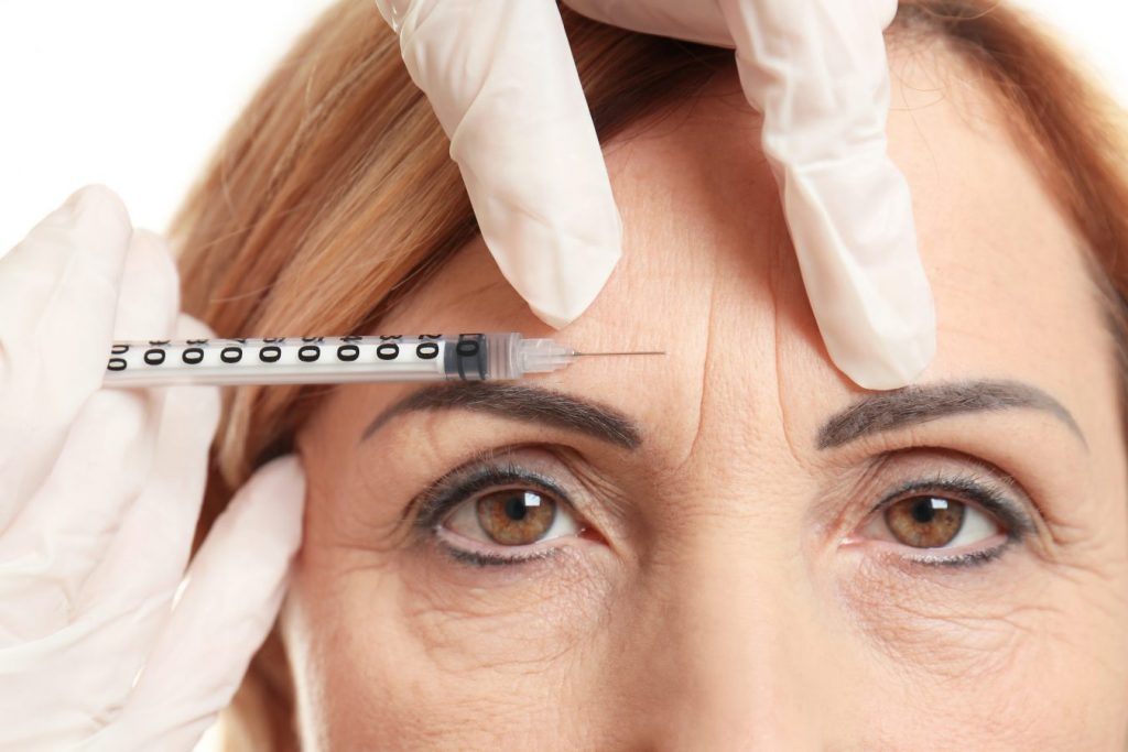 Lady getting botox injection